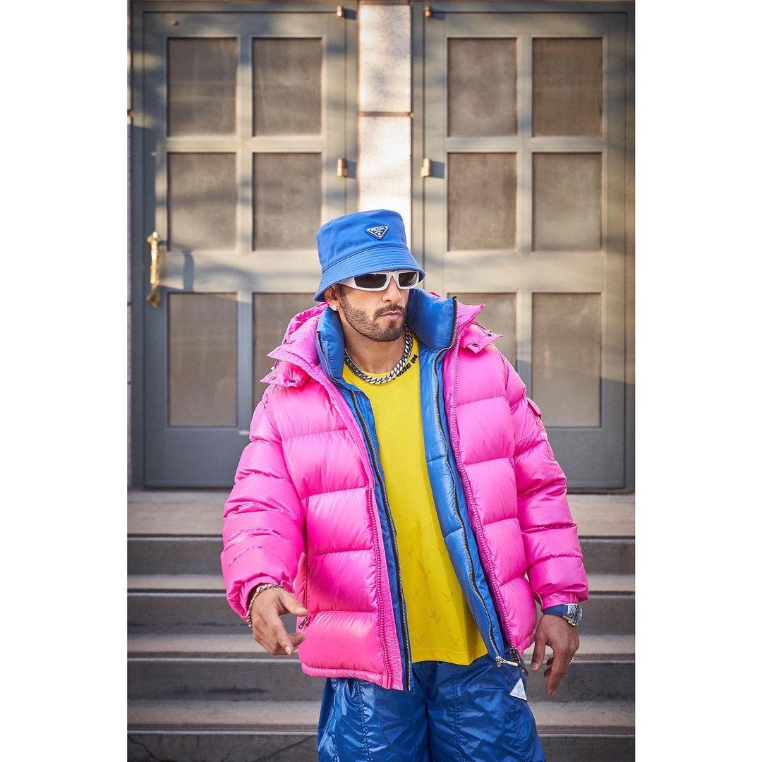 Another fashion triumph sees Ranveer sporting a quirky look that instantly captivates. He effortlessly dons blue balloon pants, expertly styled with a vibrant yellow sweater.